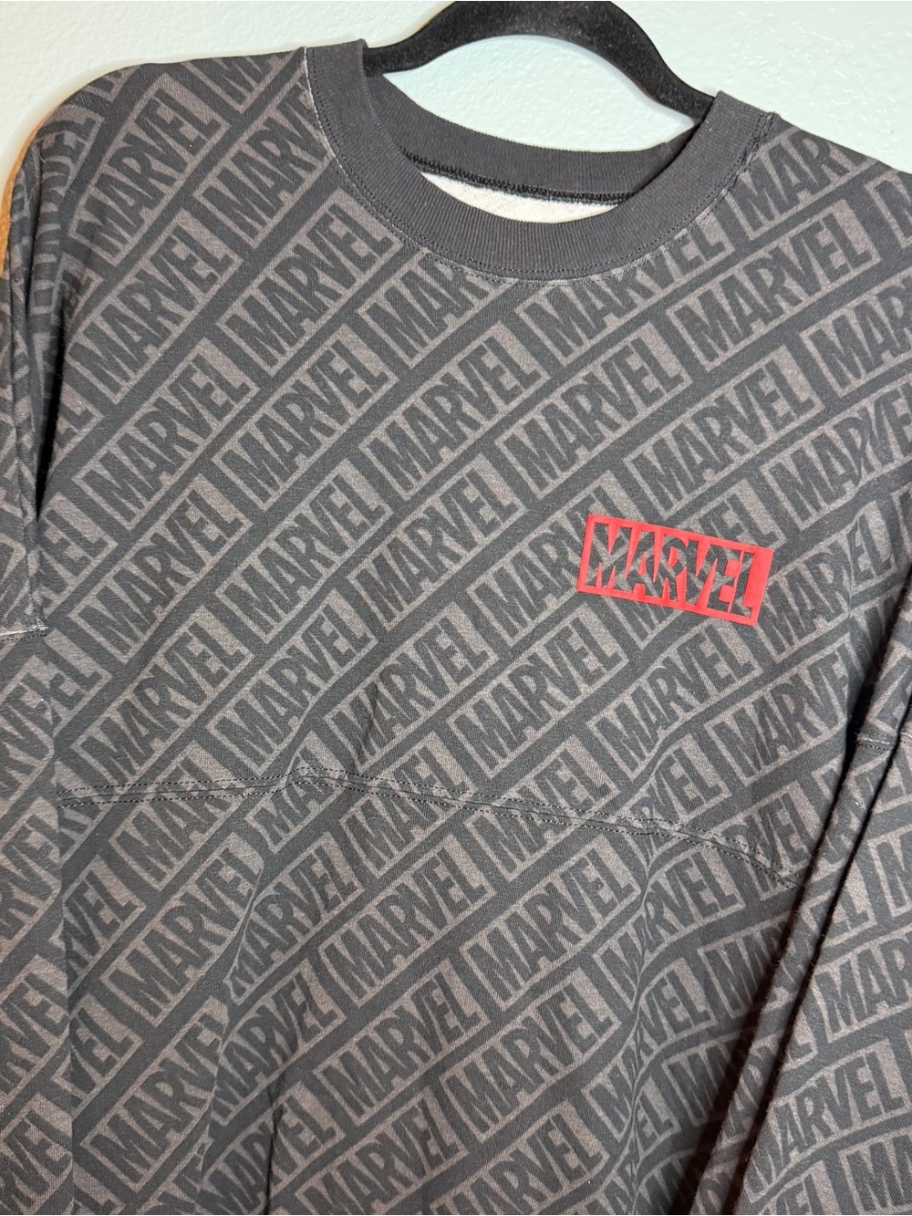 Marvel Men’s Black Long Sleeve Spirit Jersey Shirt with Red Chest and Back Logo
